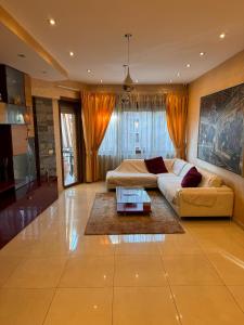 a large living room with a couch and a table at LA TORTORELLA HOME DI ROMA TALENTI in Rome