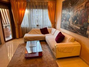 a living room with a couch and a coffee table at LA TORTORELLA HOME DI ROMA TALENTI in Rome