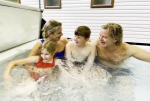 a group of people in a jacuzzi tub at Aberdunant Hall in Porthmadog