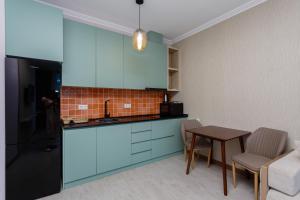 מטבח או מטבחון ב-Season Suite Apart-Hotel