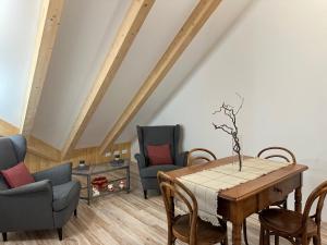 a dining room with a table and chairs at Nido di Laura in Santa Maria Maggiore