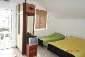 Postel nebo postele na pokoji v ubytování Apartments Mistral Orebic