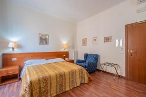 Postel nebo postele na pokoji v ubytování Hotel Monte Verde