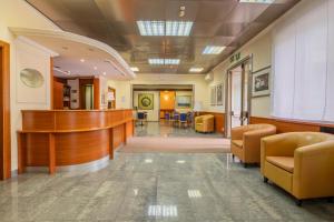 a lobby of a hospital with a desk and chairs at Hotel Monte Verde in Rome