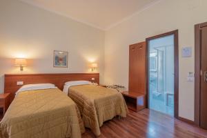 Postel nebo postele na pokoji v ubytování Hotel Monte Verde