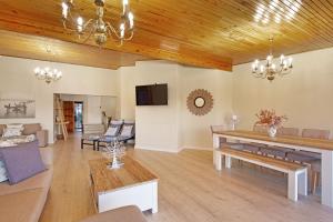 a living room with a couch and a table at Zaria Sun Penthouse by Host Agents in Cape Town