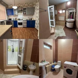 uma casa de banho com um lavatório e um WC num quarto em Мини-гостиница АЙ em Shymkent