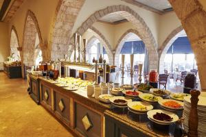 a buffet with many plates of food on a table at Kempinski Hotel Soma Bay in Hurghada