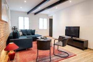 Televízia a/alebo spoločenská miestnosť v ubytovaní La maison Renaissance - Gîte 8prs