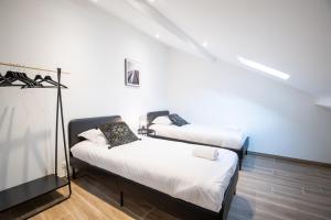 Posteľ alebo postele v izbe v ubytovaní La maison Renaissance - Gîte 8prs