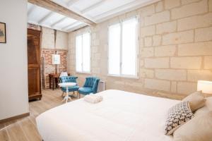 Posteľ alebo postele v izbe v ubytovaní La maison Renaissance - Gîte 8prs