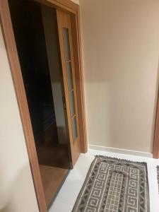 a door to a room with a rug next to it at Site in Istanbul