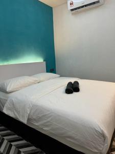 Un pat sau paturi într-o cameră la D SEGA HOTEL