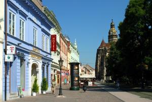 a city street with people walking down the street at Hotel Zlaty Dukat in Košice