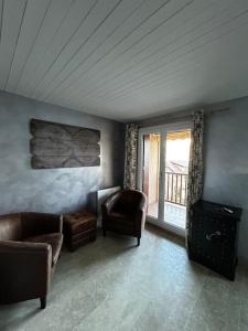 Posezení v ubytování Charmant duplex a deux pas du lac
