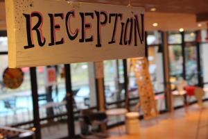 a sign for a restaurant hanging in a store at ibis Arcachon la Teste de Buch in La Teste-de-Buch