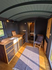 an interior view of a kitchen in a tiny house at Blue Sky Huts in Chediston