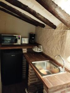 Kuchyň nebo kuchyňský kout v ubytování Alojamientos molino de revolcadores