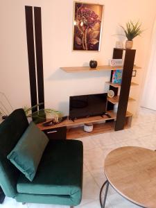 a living room with a couch and a table at home2024 in Alexandroupoli