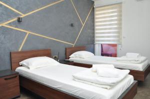 Voodi või voodid majutusasutuse Nego apartmani toas