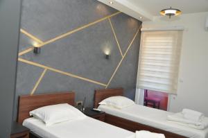 Voodi või voodid majutusasutuse Nego apartmani toas