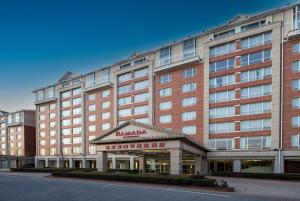 a large brick building with a hotel at Ramada Beijing North in Changping