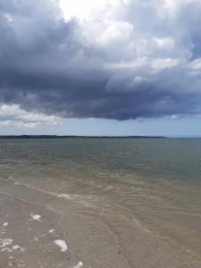 a large body of water with a cloudy sky at U Lubockich in Rewa
