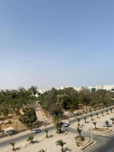 an aerial view of a street with cars and trees at Galaxy Hôtel in Sfax