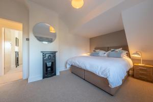 Ένα ή περισσότερα κρεβάτια σε δωμάτιο στο Golf Cottage