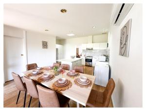 a kitchen and dining room with a table and chairs at HAVEN: Stunning Unley *history*location*charm 3bd in Unley