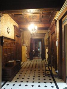 a hallway of a building with a chandelier at Le Stanze del Notaio in Genova