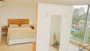 Tempat tidur dalam kamar di Mako´s Hotel