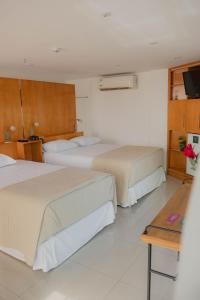 Tempat tidur dalam kamar di Mako´s Hotel