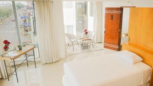 Tempat tidur dalam kamar di Mako´s Hotel