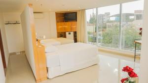 Tempat tidur dalam kamar di Mako´s Hotel