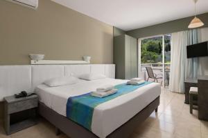 Postel nebo postele na pokoji v ubytování Lito Hotel
