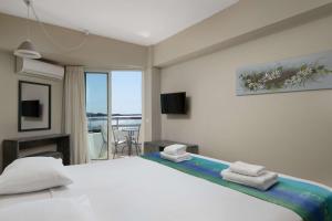 Postel nebo postele na pokoji v ubytování Lito Hotel