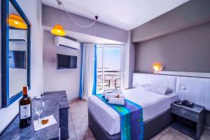 Postel nebo postele na pokoji v ubytování Lito Hotel