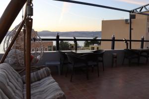 a balcony with a table and chairs and a view at Sejan hotel in Aqaba