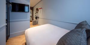 Letto o letti in una camera di Urban Hive Milano