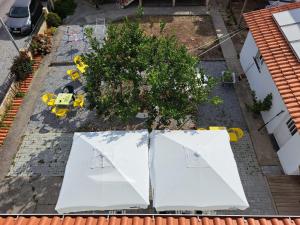 an overhead view of a house with white roofs at Hostel do Alto - Fão in Esposende