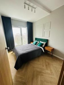 เตียงในห้องที่ Apartament z dwoma pokojami Polanka Poznań