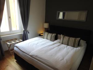 Postel nebo postele na pokoji v ubytování Boutique-Hotel Antica Posta