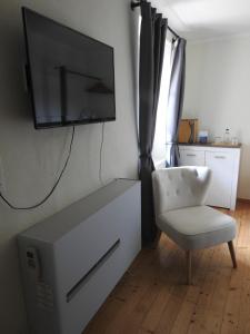 TV a/nebo společenská místnost v ubytování Boutique-Hotel Antica Posta