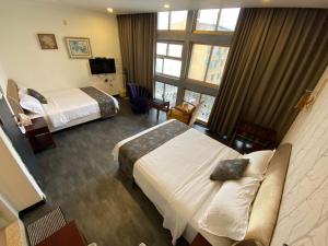 Postel nebo postele na pokoji v ubytování Kenting Heng-Chung Art Hostel