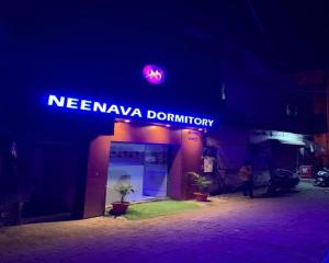 a sign that says nevanaya domination on a building at Neenava Dormitory Asalpha in Mumbai