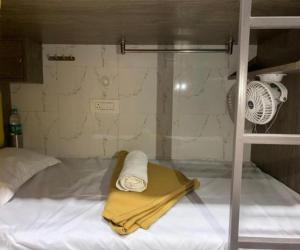 Postel nebo postele na pokoji v ubytování Neenava Dormitory Asalpha