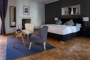 Postel nebo postele na pokoji v ubytování Boutique-Hotel Antica Posta