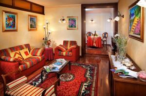 a living room with a couch and a table at Hotel La Ruota in Pianfei