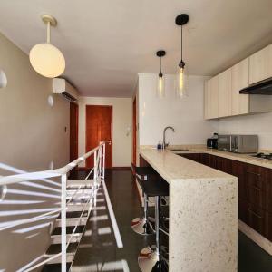 a kitchen with a sink and a counter top at Departamento para 4 personas en 2° piso. in Talca